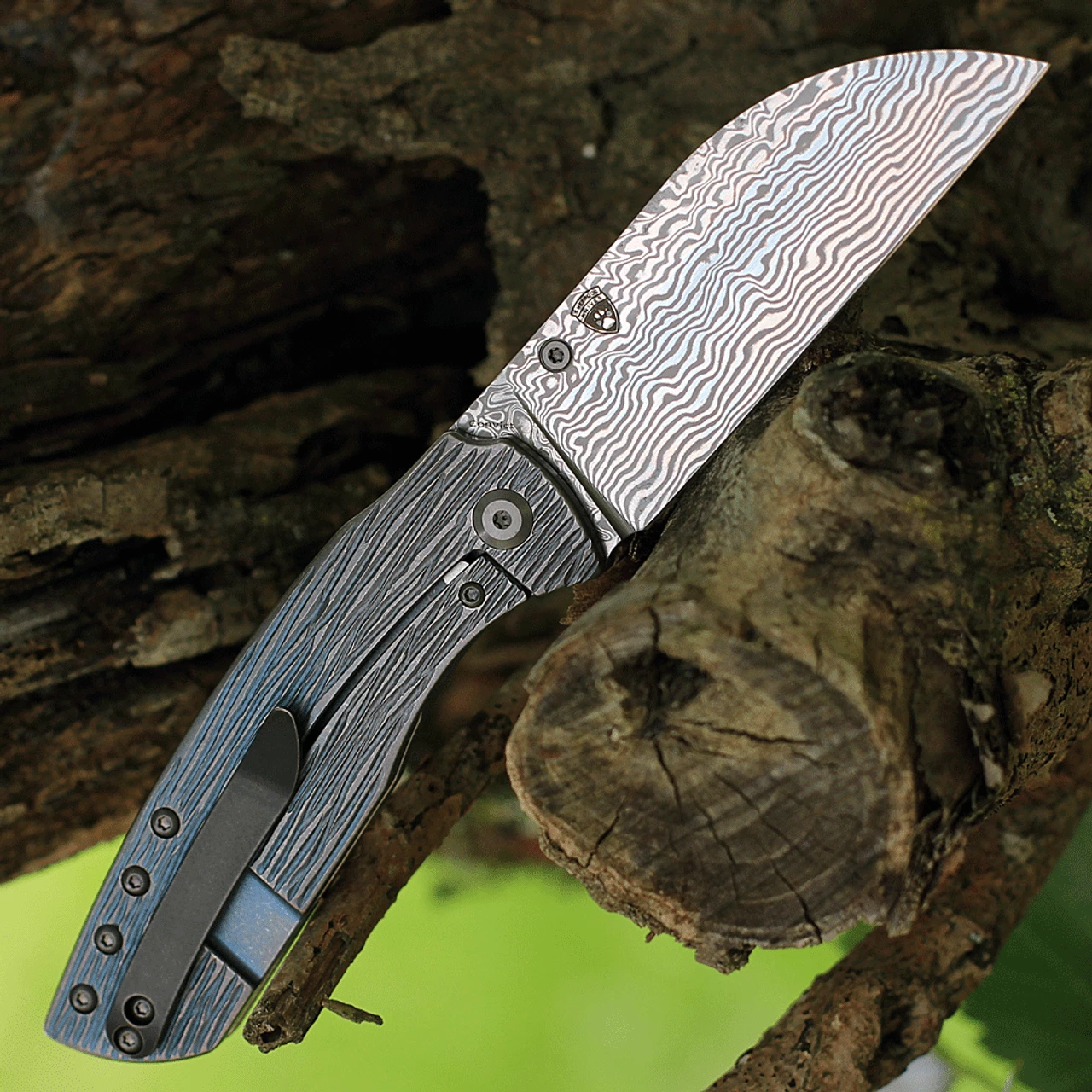 Kansept Knives Convict K1023W1, 3.3" Damascus Steel Sheepfoot Blade, Blue Titanium Wood Grain Handle 4 Kansept Knives Convict K1023W1, 3.3" Damascus Steel Sheepfoot Blade, Blue Titanium Wood Grain Handle - Image 2